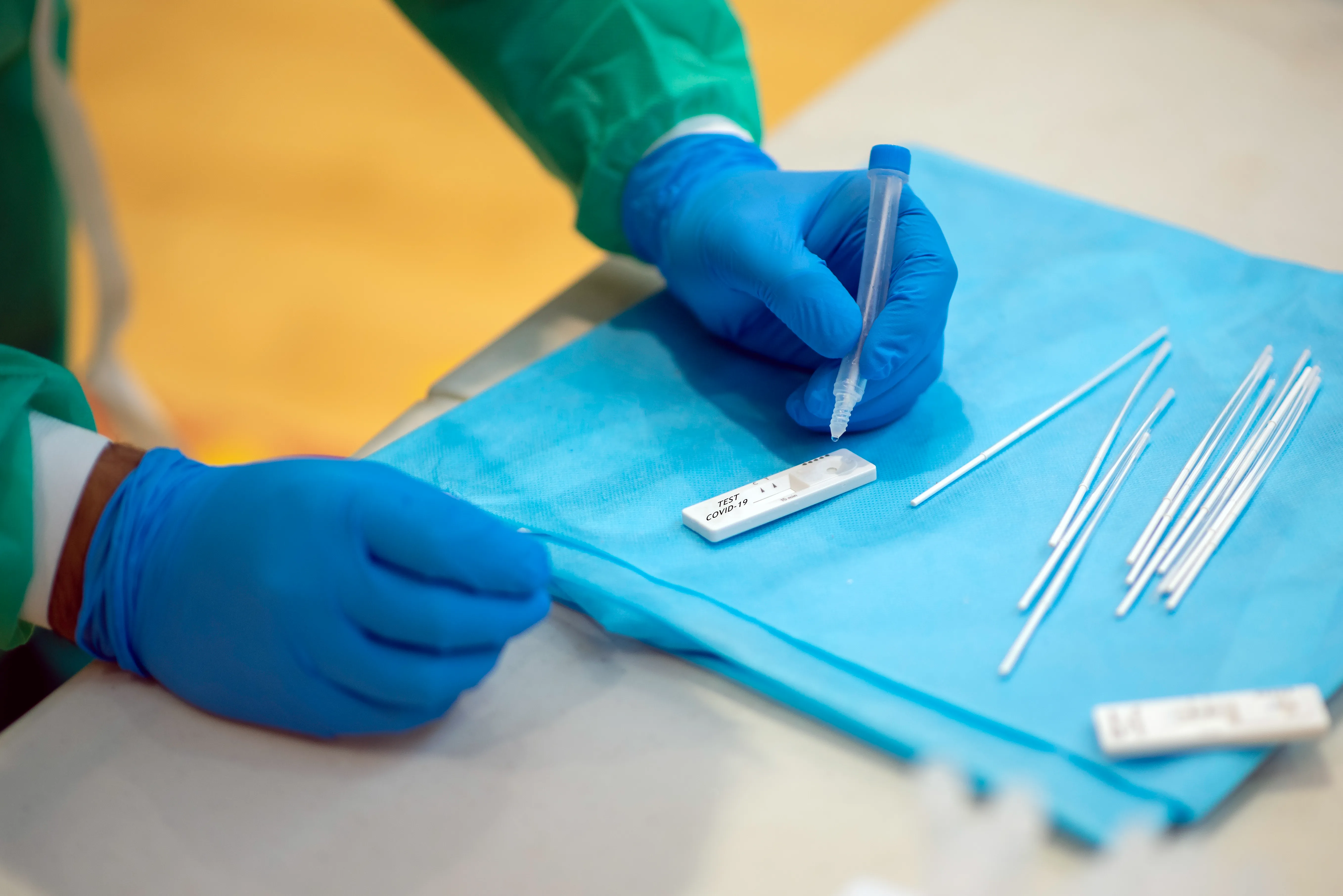 A clinician with stethoscope and laptop – thorough, professional care.